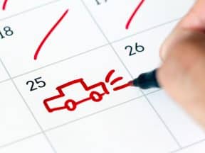 Marking a trip on calendar. Drawing a car. Vacation concept